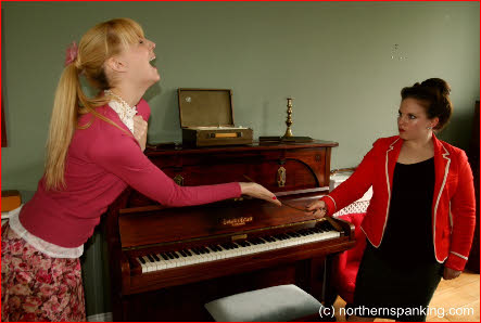 Submissive blonde receives discipline from strict female school teacher