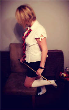 Sub spankee in schoolgirl uniform