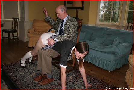 School tutor raises his hand high above sub spankee Pandora's buttocks